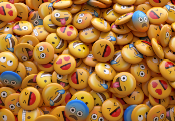 a pile of different emoji pins