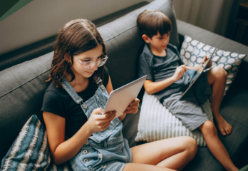 data-privacy-with-children-featuring-two-siblings-holding-ipads