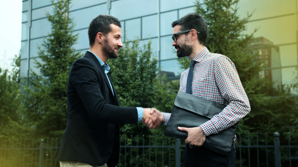 two-business-owners-discussing-m&a-deal-structure