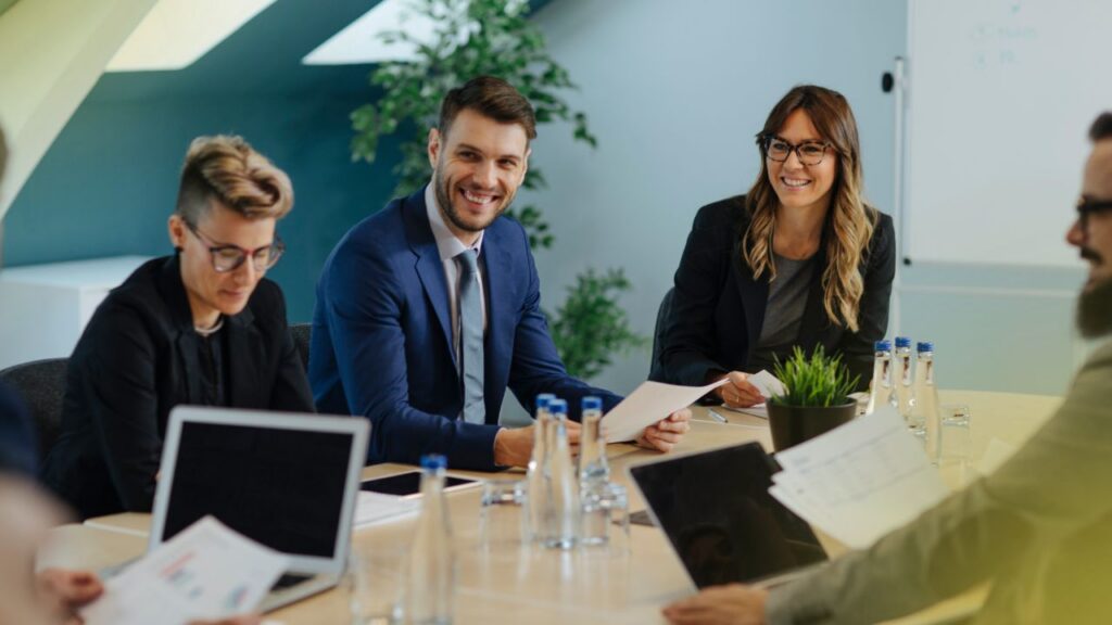 business-owner-engaged-and-listening-to-ideas-at-conference-table