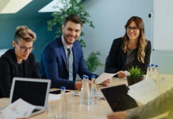 business-owner-engaged-and-listening-to-ideas-at-conference-table